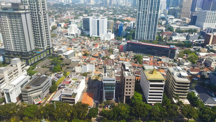 Obraz premium Aerial Cityscape with High-Rises and Urban Housing