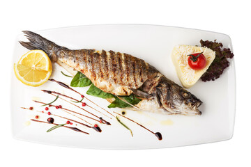 Grilled sea bass with risotto, lemon, and basil on white plate with transparent background