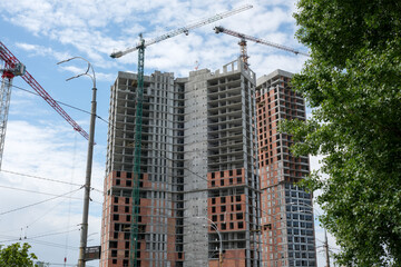 Construction of a modern high-rise building in a bustling urban area