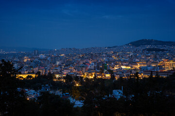 Scenic view of downtown of Athens in Greece at dusk. Urban skyline, metropolis and city view during blue hour.