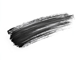 Black mascara smudge on white background.  A stroke of black mascara, streaked and textured, against a plain white backdrop.  The product is visually showcased