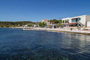 Idyllic village by the Aegean Sea on Telendos island in Greece on a sunny day.