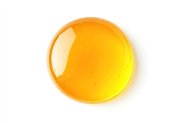 Round puddle of golden-orange, viscous liquid, glossy surface, isolated on white background