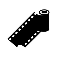 A photographic film roll unspooled from the core in dramatic black silhouette