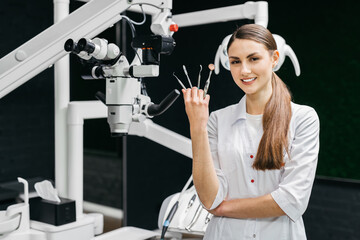 Dentist on the background of a modern dental office. The concept of dental services. 
