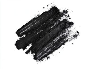 Black makeup smudge on white background.  Detailed texture of the product