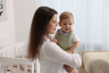 Mother with her cute little baby at home