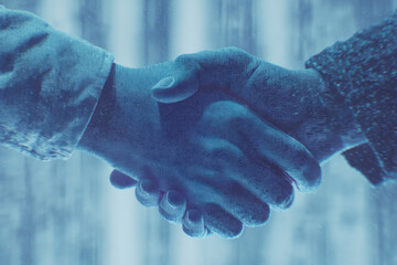Handshake Representing Business Agreement in Harsh Conditions
