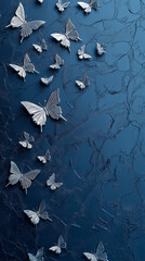 Elegant white butterflies on a dark blue textured background with copy space
