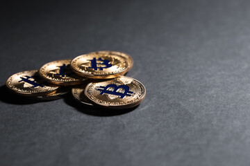 Cryptocurrency. Golden bitcoins on grey background, closeup. Space for text