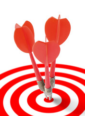 Targeting. Three darts in center of bullseye on white background