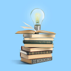 Light bulb on stack of books against light blue background. Idea and knowledge