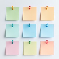 Colorful Sticky Notes Arranged on White Background, Secured with Decorative Push Pins for Organization and Reminders.