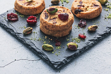 Tasty round homemade healthy biscuit made of oats, butter, nuts and dried fruits