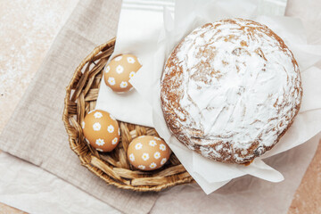 Traditional Easter cake with hand-painted daisy eggs on fabric. Homemade festive baked goods and...
