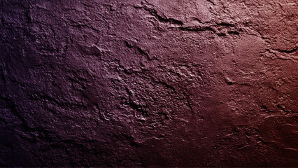cracked stone wall background close up. Maroon grungy background