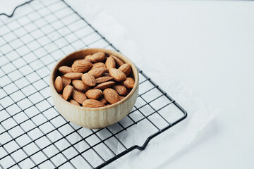 Bowled almonds resting on a cooling rack ready for snacking