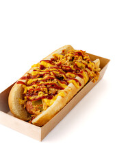 Hot dog with ketchup drizzle isolated on white background