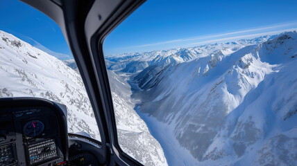 Aerial view of snow-covered mountain range from airplane cockpit