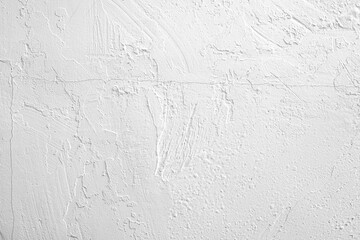 White textured wall with subtle patterns and grooves in indoor setting