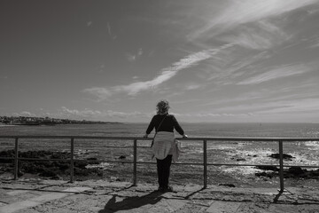 Rear view of young woman looking at sea view