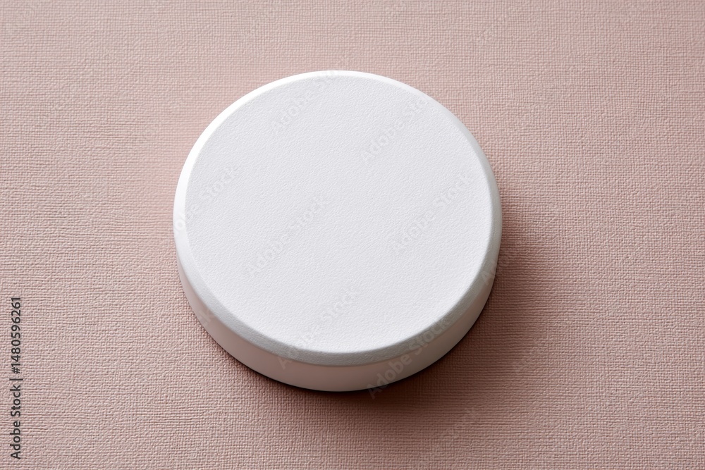 Poster white round container on pink background - a clean of a white round container against a soft pink te