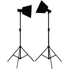 Professional studio photography equipment includes an isolated flash strobe with a softbox and umbrella on a metal stand with a tripod for controlled lighting