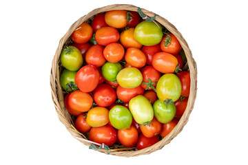 Colorful tomatoes in a basket isolated on white background, top view