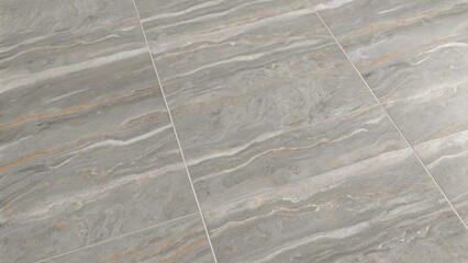 Subtle grey marble tiles display soft lines of contrasting white and gold veins