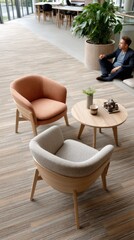 Fototapeta premium Bright and airy living room showcases orange and grey armchairs, a white sofa, and a natural wood coffee table in a stylish arrangement