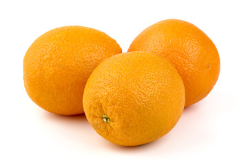 Pile of fresh whole oranges, isolated on white background