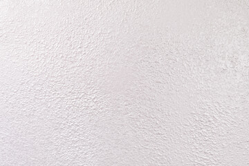 Shiny silver pearl metallic paper texture with glitter accents. Rich, luxurious festive backdrop.