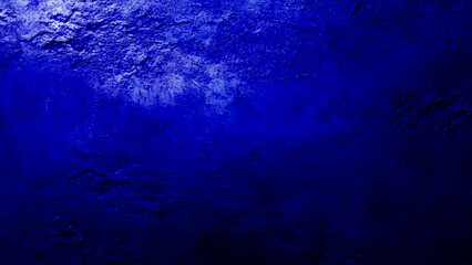 Rustic blue wall background with darker black grungy border and vintage texture design. Textured dark blue wall background with a grunge aesthetic ideal for artwork presentation, featuring deep navy t