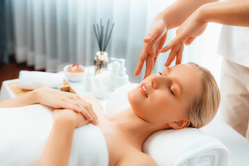 Caucasian woman enjoying relaxing anti-stress head massage and pampering facial beauty skin...
