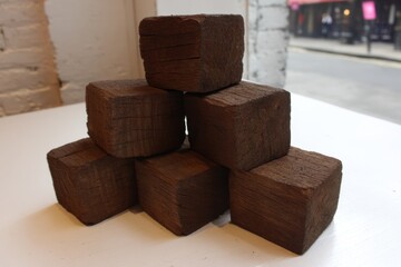 Riga, Latvia 2025-04-25 A stack of wooden blocks sitting on top of a table