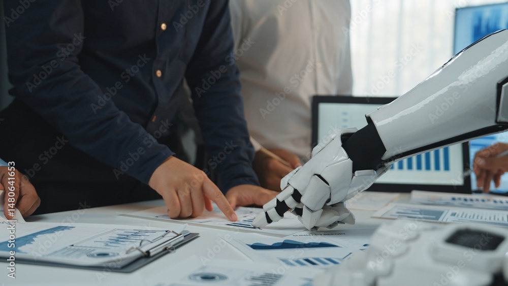 Poster a team of business professionals engages with an advanced robotic arm, analyzing data charts and rep