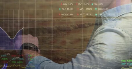 Man extending forearm over ocean waves at sunset, overlaying financial grid chart and stock arrows - Powered by Adobe