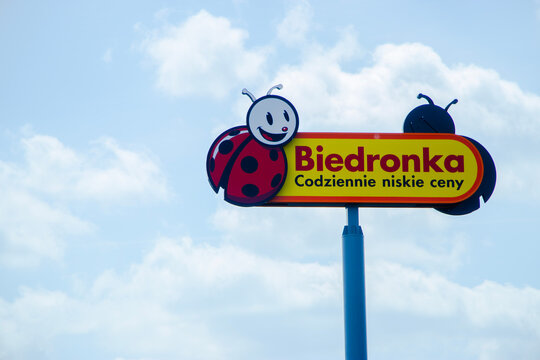 Biedronka sign on wholesale store building in Poland, recognizable logo of the international retail chain, close-up view, editorial use only, business and commerce industry	