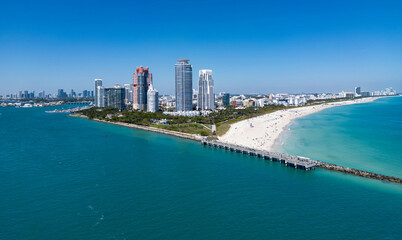 Obraz premium Miami Beach skyline aerial view. Miami city from drone. Tropical Miami scene. Miami district sky view. Famous oceanfront. Panoramic coastline. South beach panorama view. Summer travel in Florida.