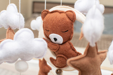 Baby crib mobile with moon, bear, stars and clouds