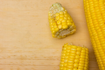 Sweet Yellow Corn On A Wooden cutting board.