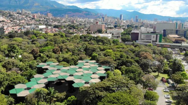 Aerial View of Medellin's Botanical Garden and City Skyline