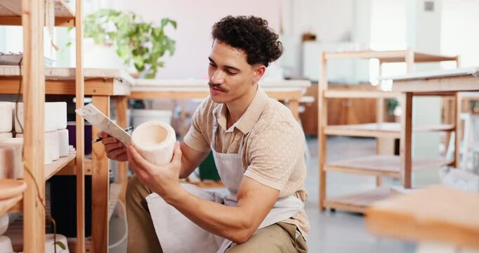 Pottery studio, small business and man with clipboard for inventory, management and planning in store. Startup owner, writing and ceramics checklist, stock or invoice by shelf for craft product