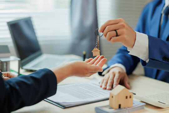 Client pays the agent, who hands over the house keys, marking the official closing and completion of the real estate transaction.