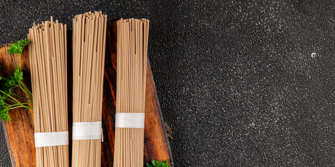 Buckwheat noodles raw soba fresh pasta dish natural food Asian cuisine on the table rustic food top view copy space