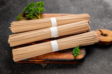 Buckwheat noodles raw soba fresh pasta dish natural food Asian cuisine on the table rustic food top view copy space