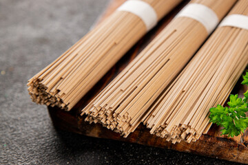 Buckwheat noodles raw soba fresh pasta dish natural food Asian cuisine on the table rustic food top view copy space