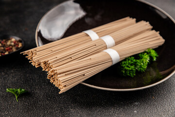 Buckwheat noodles raw soba fresh pasta dish natural food Asian cuisine on the table rustic food top view copy space