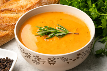 Delicious lentil, ezogelin or pumpkin soup on stone  background