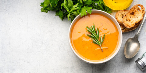 Delicious lentil, ezogelin or pumpkin soup on stone  background